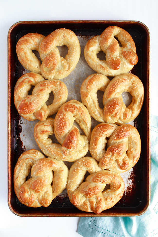 Soft and Chewy Salted Buttered Pretzels on a baking sheet