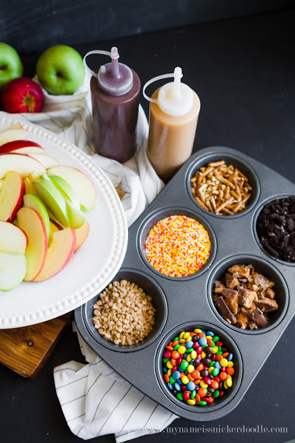 Caramel Apple Nacho Bar with chocolate syrup, sprinkles, candies and pretzels