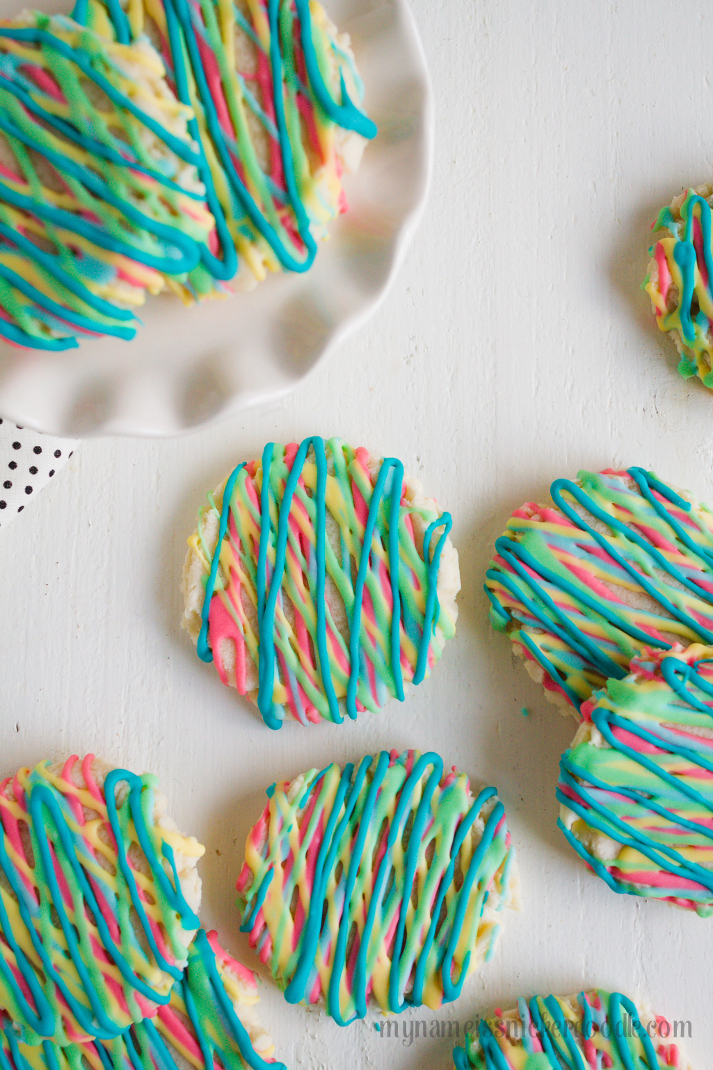 Colorful Sugar Cookies are a fun way to explore color and eat your food too. These delicious sugar cookies are made with an easy recipe that will keep you coming back for more. It will become your new go to sugar cookie recipe. #sugarcookies #cookierecipe #sugarcookierecipe #swigsugarcookierecipe