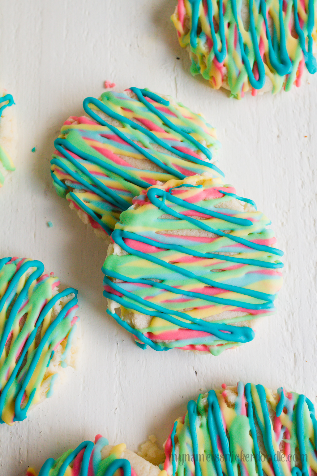 Colorful Sugar Cookies are a fun way to explore color and eat your food too. These delicious sugar cookies are made with an easy recipe that will keep you coming back for more. It will become your new go to sugar cookie recipe. #sugarcookies #cookierecipe #sugarcookierecipe #swigsugarcookierecipe