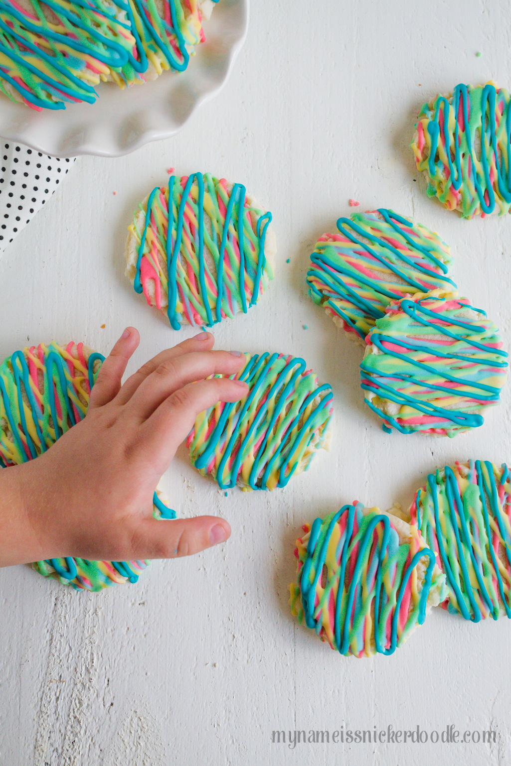 Colorful Sugar Cookies are a fun way to explore color and eat your food too. These delicious sugar cookies are made with an easy recipe that will keep you coming back for more. It will become your new go to sugar cookie recipe. #sugarcookies #cookierecipe #sugarcookierecipe #swigsugarcookierecipe