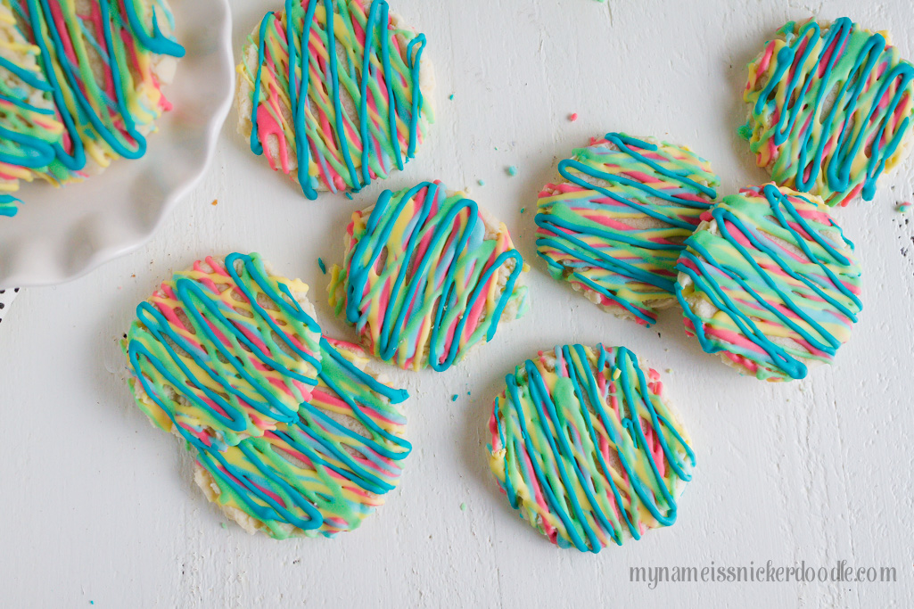Colorful Sugar Cookies are a fun way to explore color and eat your food too. These delicious sugar cookies are made with an easy recipe that will keep you coming back for more. It will become your new go to sugar cookie recipe. #sugarcookies #cookierecipe #sugarcookierecipe #swigsugarcookierecipe