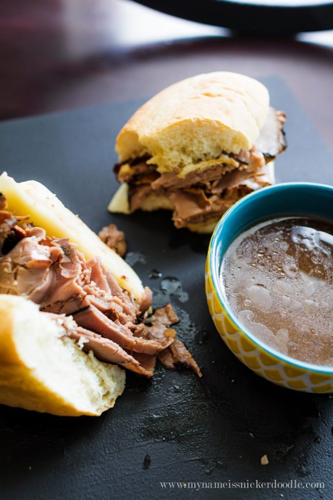 Easy Slow Cooker French Dip Sandwiches With Au Jus On a Platter
