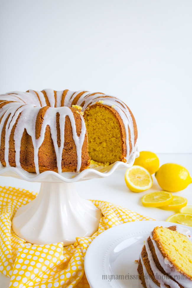 Lemon Bunt Cake Sliced On A White Cake Plate