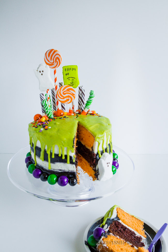 Halloween Layered Vanilla and Chocolate Cake With Candy, Suckers and Gumballs