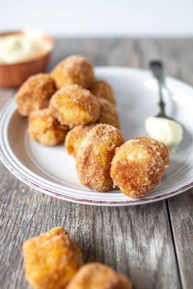 Cinnamon Sugar Soft Pretzels bites on a white plate