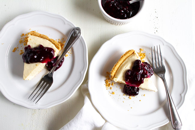 Two slices of no bake cheesecake with blueberry topping.  