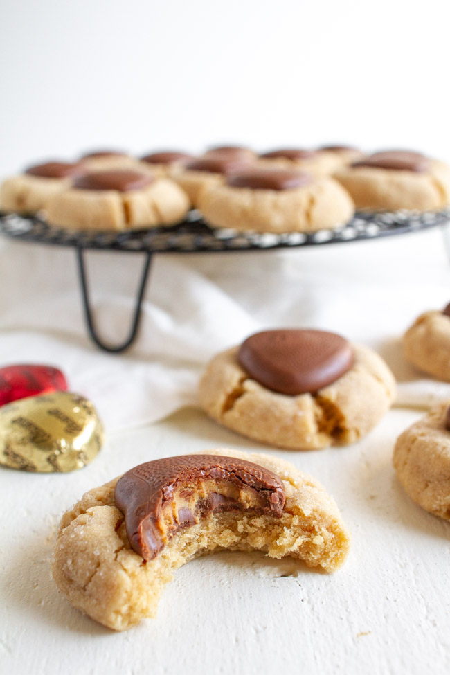 Peanut Butter Blossom with a chocolate heart with a bite take out of it.