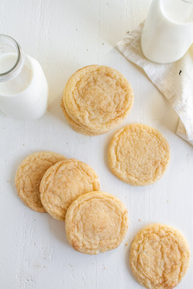 Snickerdoodle cookies on a white table.