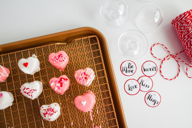 Pink and white tiny heart cakes on a wire rack