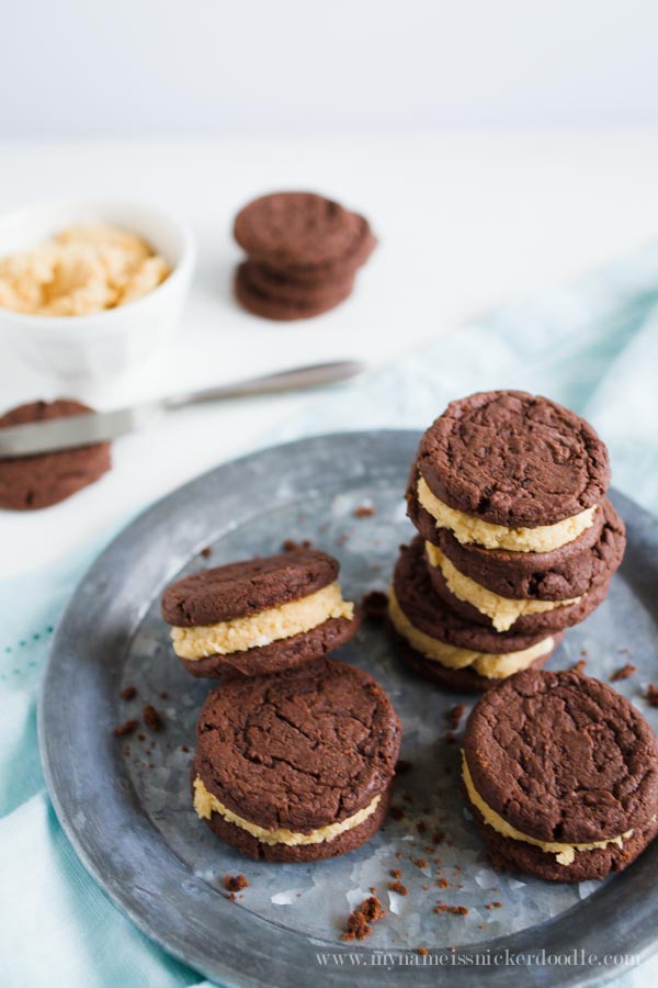 Chocolate Sandwich cookies with a peanut butter filling on a silver plate