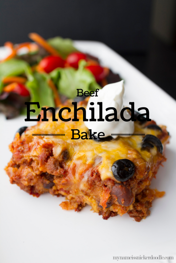 Beef Enchilada Bake on a white plate with a dollop of sour cream.