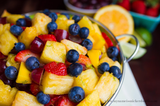 Pineapple, strawberries and blueberries in a bowl.