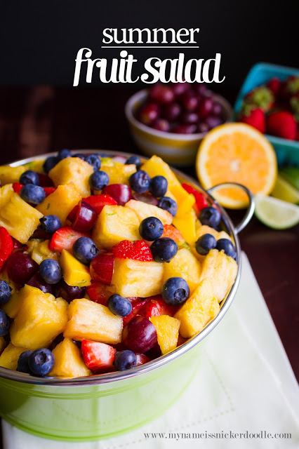 Fruit Salad in a green bowl on a table.  