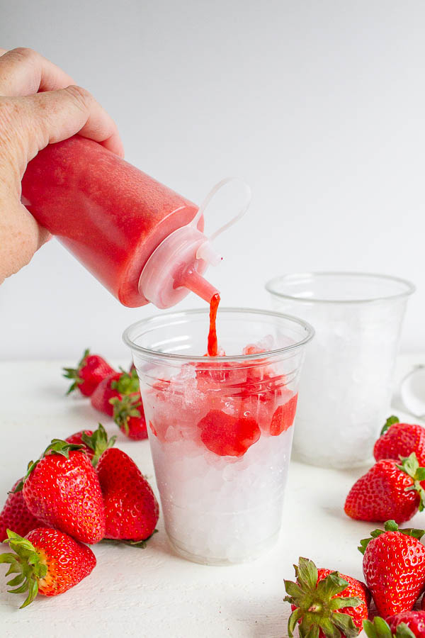 A squeeze bottle of strawberry puree.  