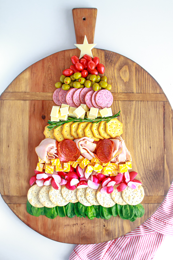 The Ultimate Holiday Appetizer!  A Christmas Tree Cheese and Cracker Tray would be great for any holiday party.  Full of meats, cheeses, crackers and vegetables.  The easiest charcuterie board to assemble!  #charcuterie #holidayappetizer #mynameissnickerdoodle #cheeseandcrackers #partyfood #christmasappetizers #easyappetizers #appetizerrecipes #christmasrecipes