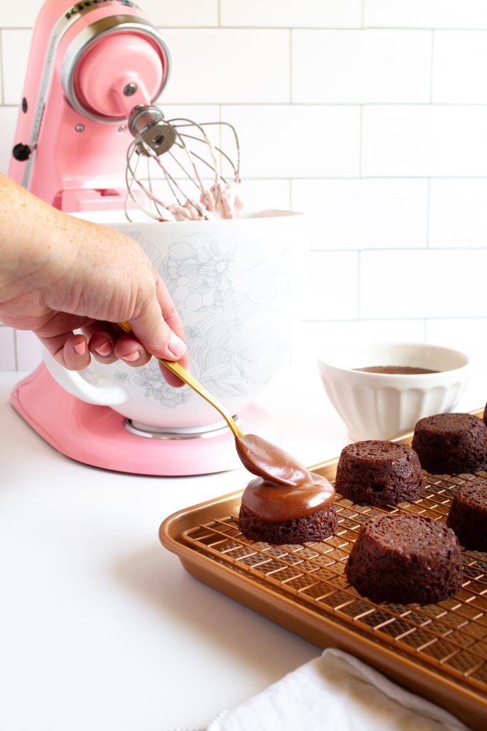 Chocolate ganache spooned over the best little mini chocolate cakes!  