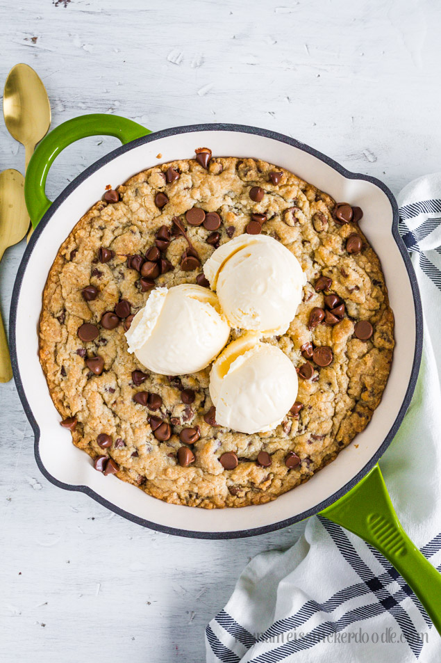 Chocolate Chip Skillet Cookie is served warm with a few scoops of ice cream on top to finish it off!  