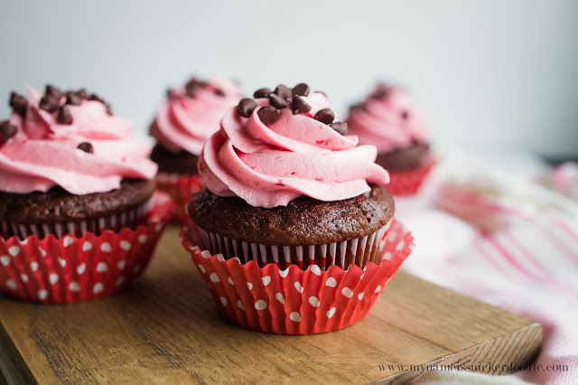 Raspberry Buttercream Frosting on top fo Chocolate Cupcakes