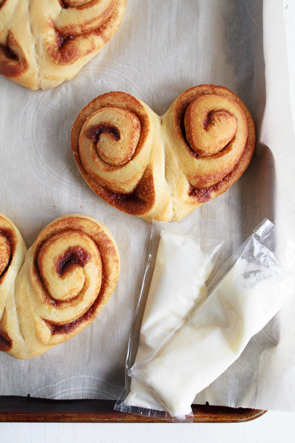 Two cinnamon rolls baked into a Heart Shaped Cinnamon Roll.