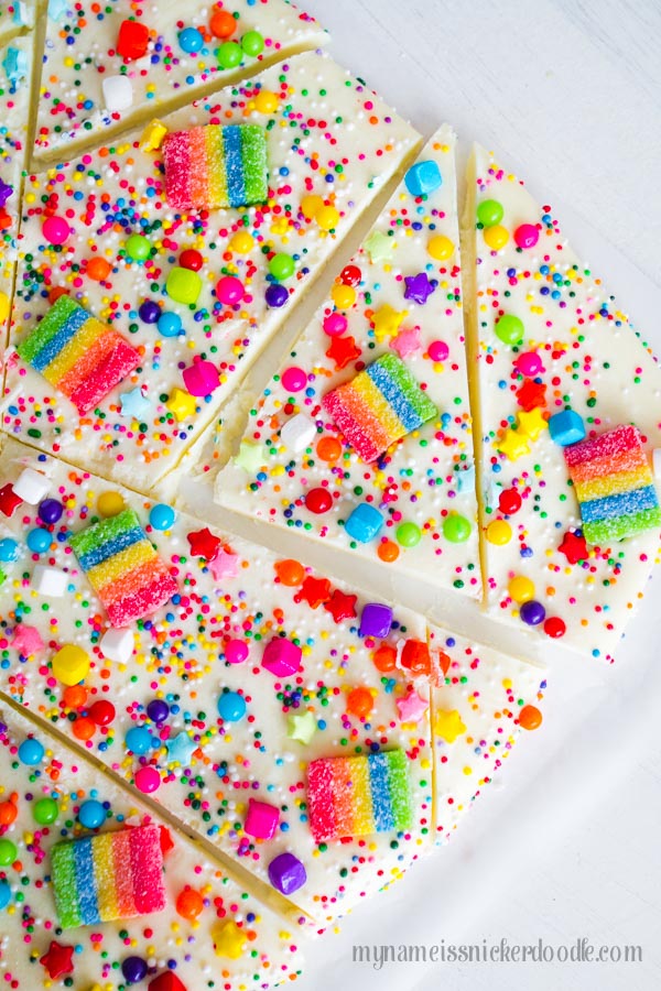 Melted white chocolate with rainbow sprinkles on top.