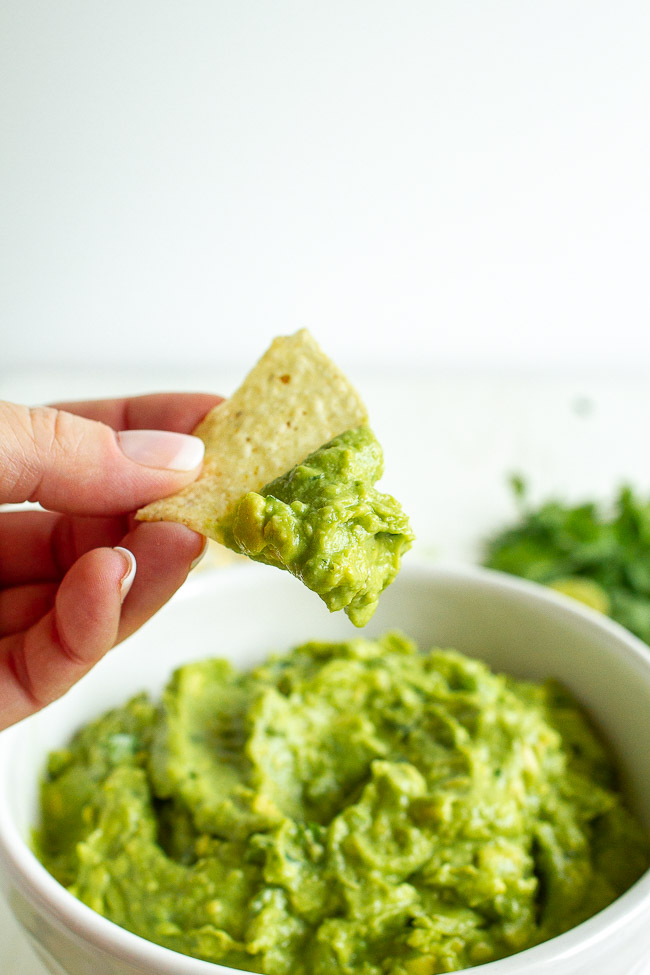 This Easy Guacamole is super simple to make and only has a few ingredients. Fresh lime juice, cilantro, garlic and salt. And of course ripe avocados! It's tasty and pretty mild so you can add some spice with fresh jalapeños.