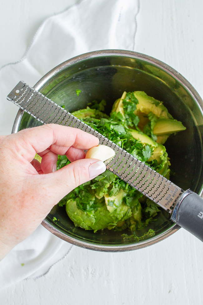 Grated garlic with avocados and cilantro.