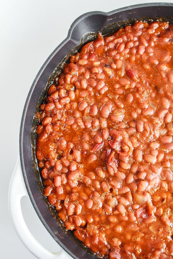 Easy side dish of beans in a black cast iron skillet.