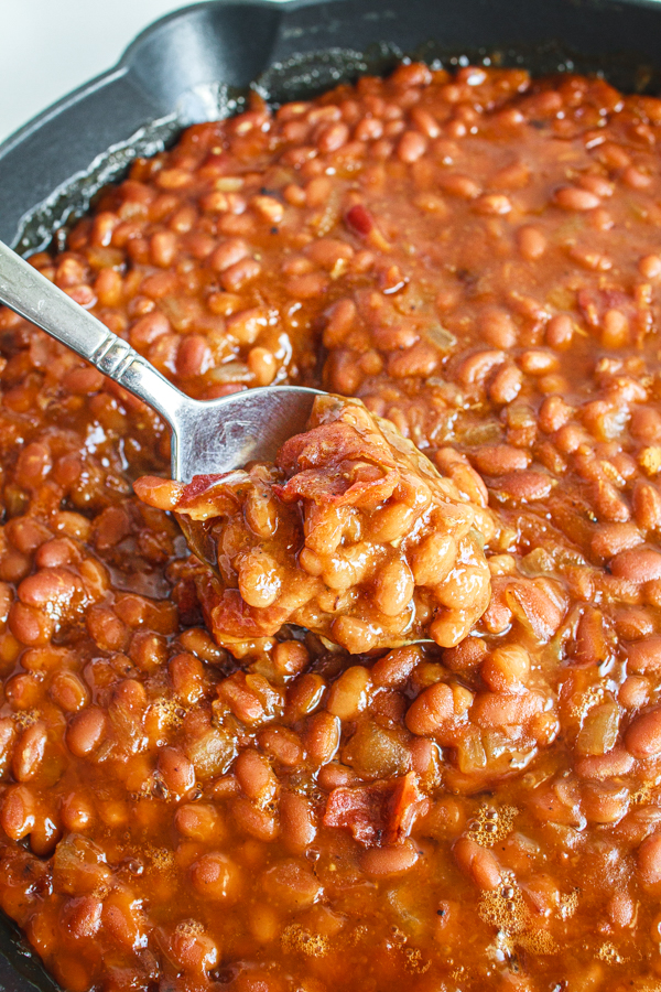 A spoonful of the easiest baked beans recipe.