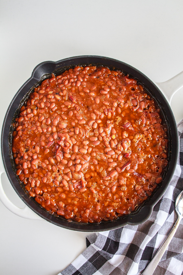 BBQ beans in a black skillet.