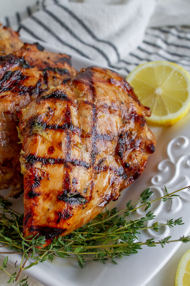 Grilled Lemon Chicken on a white plate.