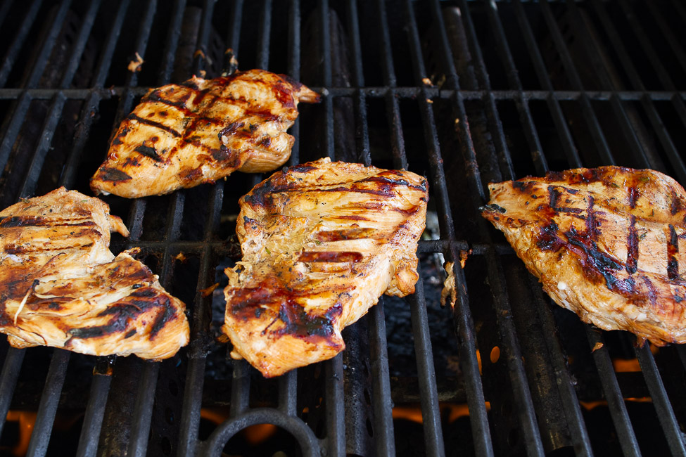 Chicken breasts on a hot grill.