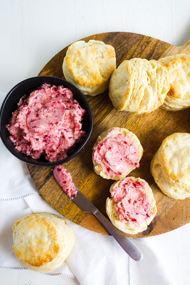 Buttermilk Biscuits spread with homemade raspberry butter.