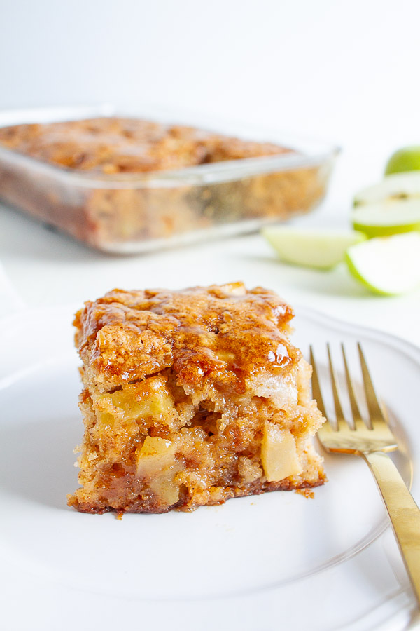 Apple Cake With A Caramel Glaze on a white plate.