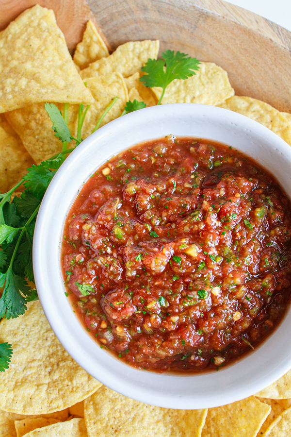 A white bowl full of easy restaurant style salsa.