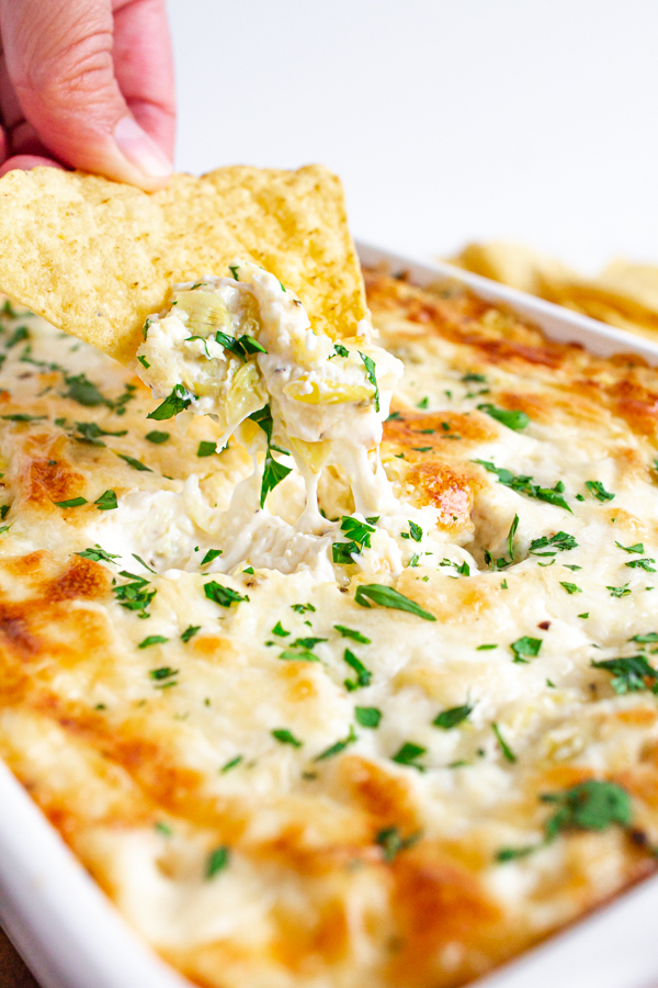 Hot Artichoke Dip with a tortilla chip