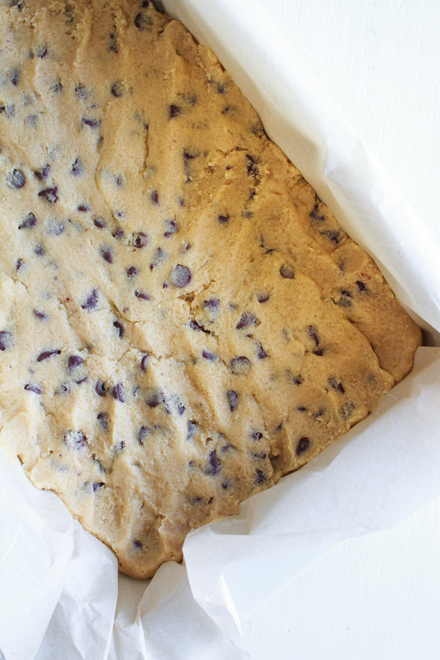 Chocolate Chip Cookie Dough pressed into a white dish.