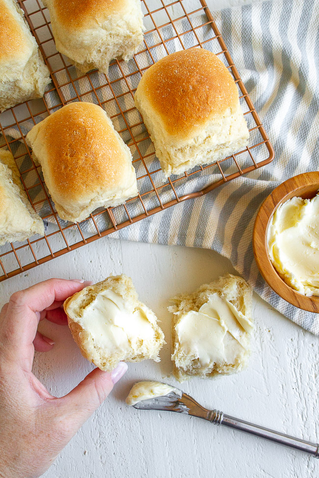 Easy homemade rolls spread with butter.