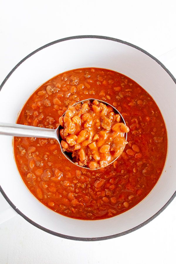 A ladle full of homemade chili.