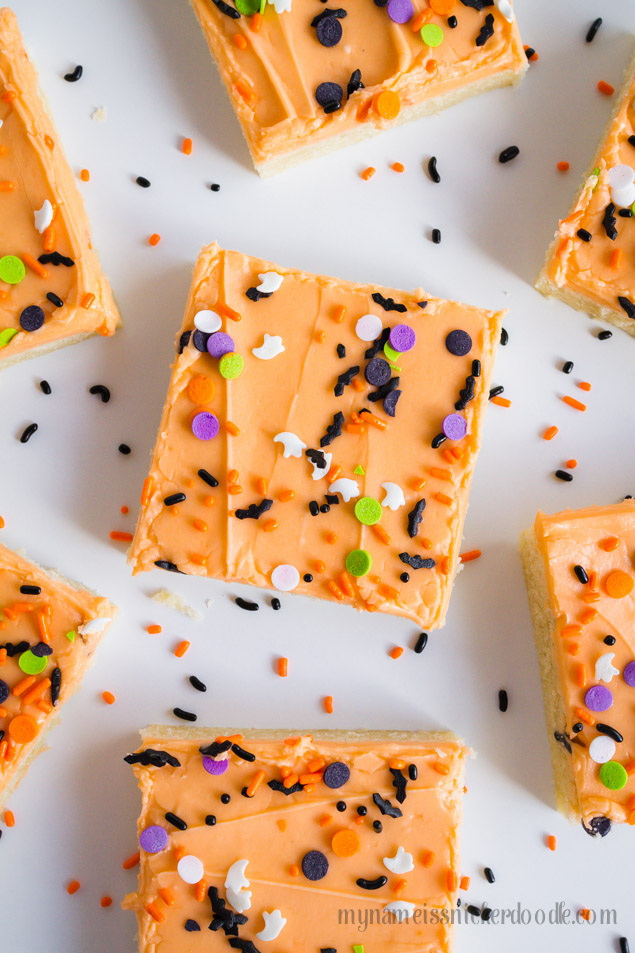 Halloween Sugar Cookie Bars can be made in 30 minutes from start to finish.  The entire recipe makes 30 cookies and is perfect for a party, potluck or get together!  The dough is tender and soft and the buttercream frosting is super creamy and smooth.  Use any festive sprinkles you have and don't be afraid to mix to varieties together.