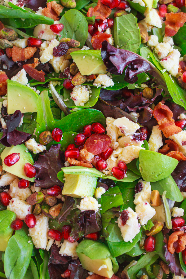 Holiday recipe for Pomegranate Avocado Salad with bacon, pistachios and wensleydale cheese.