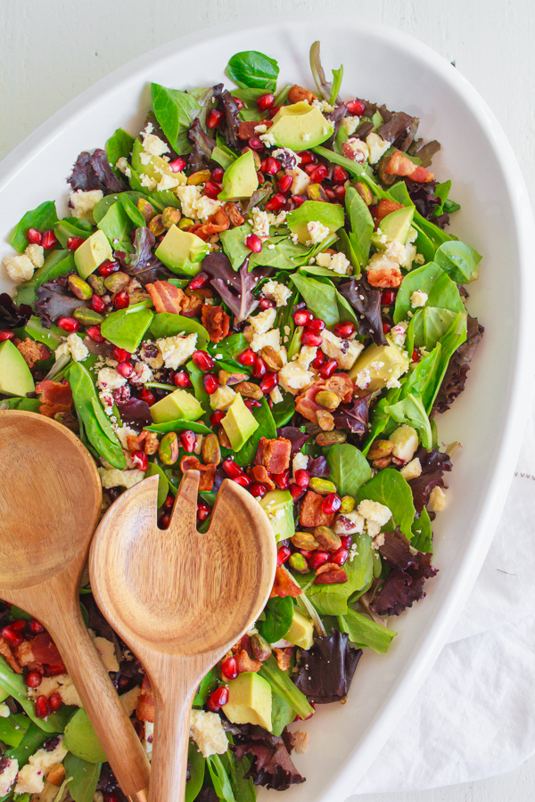 Holiday recipe for Pomegranate Avocado Salad with bacon, pistachios and wensleydale cheese.