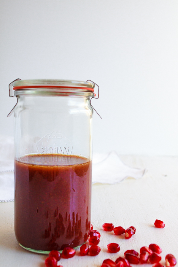 Pomegranate Salad Dressing recipe in a glass jar.