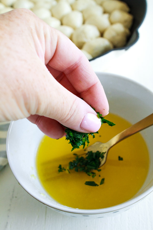 Garlic parsley butter in a white bowl