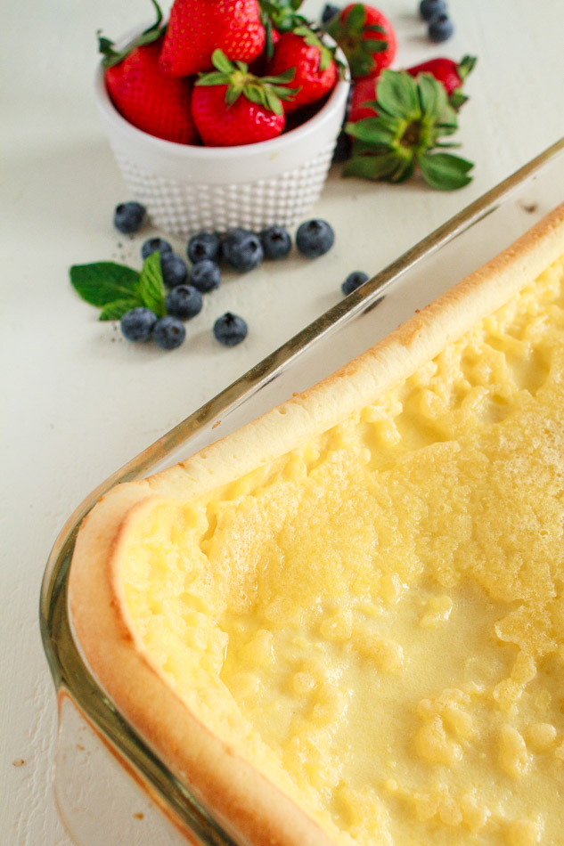 Fluffy Dutch Baby Pancakes in a clear baking dish.