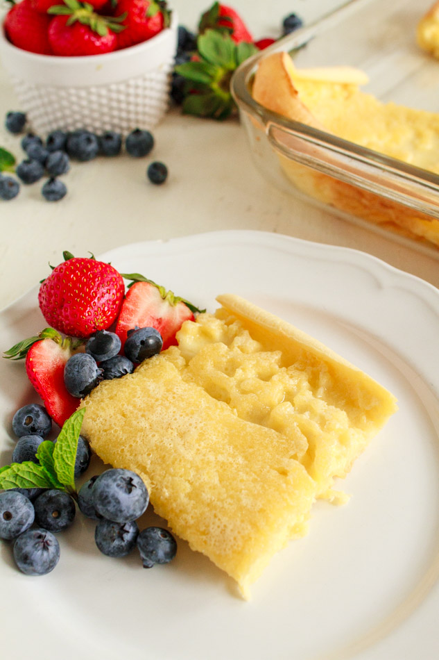 A square of Dutch Baby Pancake on a white plate.