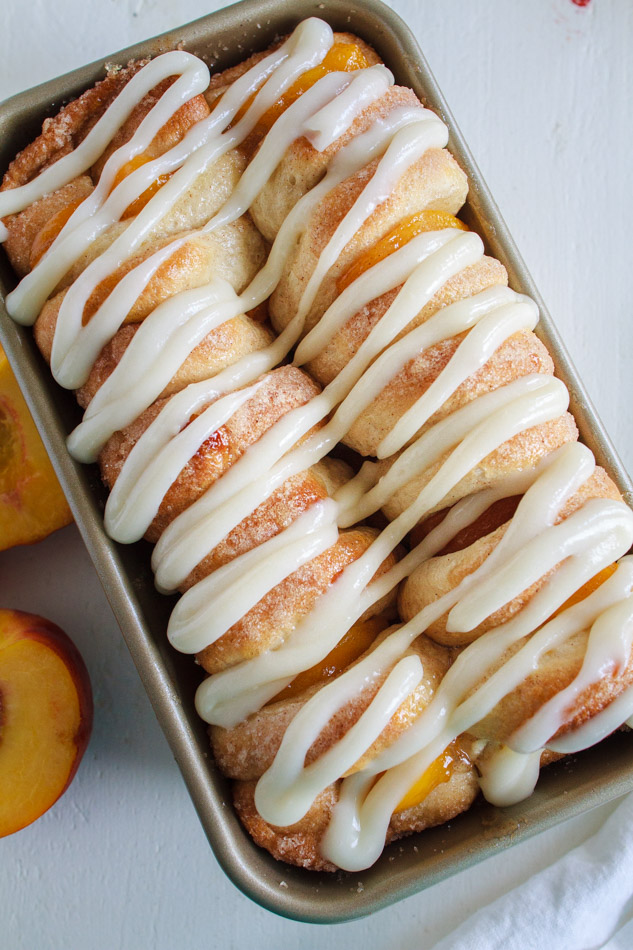 Peaches and Cream Pull Apart Bread 
 recipe with a sweetened Cream Cheese Glaze in a loaf pan.