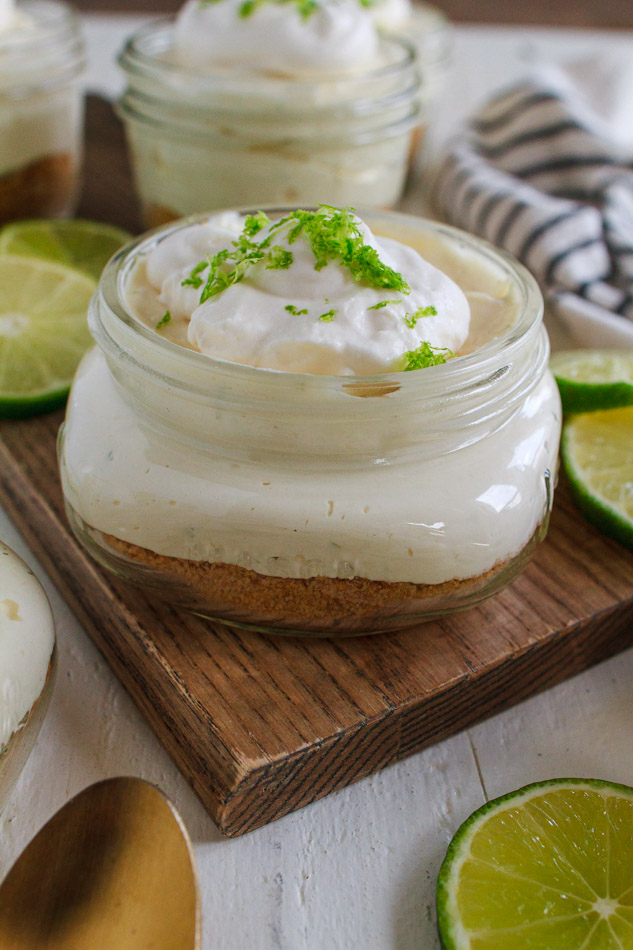 No Bake Mini Key Lime Cheesecakes are not only super creamy, but full of citrus zing.  Made with a simple graham cracker crust and topped with fresh whipped cream and lime zest.  