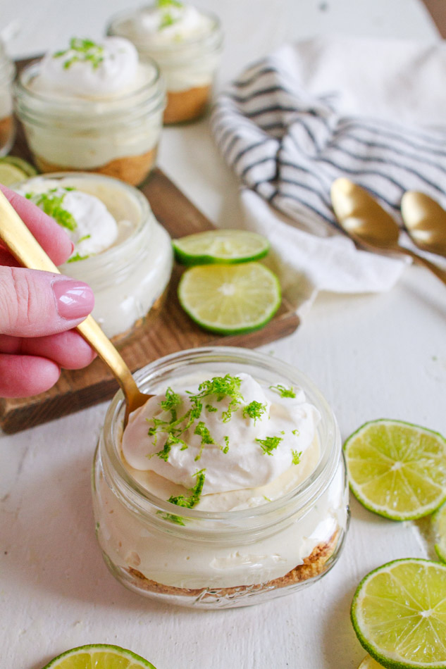 No Bake Mini Key Lime Cheesecakes are not only super creamy, but full of citrus zing.  Made with a simple graham cracker crust and topped with fresh whipped cream and lime zest.  