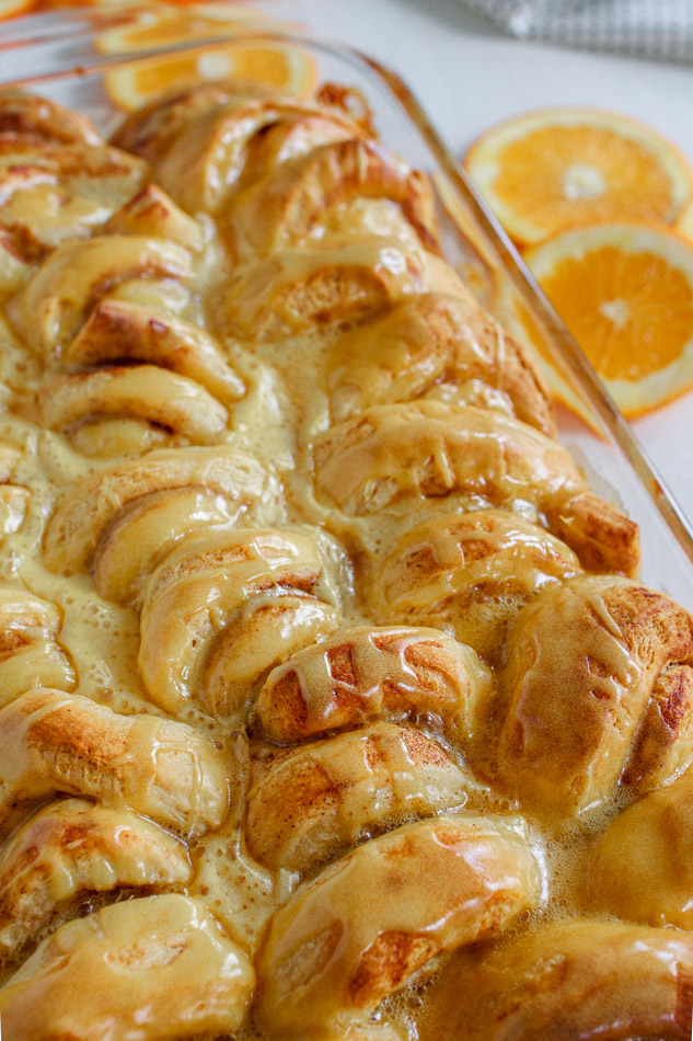 Easy Orange Sweet Rolls are just as easy as boiling water.  Yes, these are semi-homemade so you don't have to worry if you don't know how to make bread from scratch.  It's the extra steps of adding cream, brown sugar and orange zest to the bottom of the pan that creates these ooey-gooey Orange Rolls.  